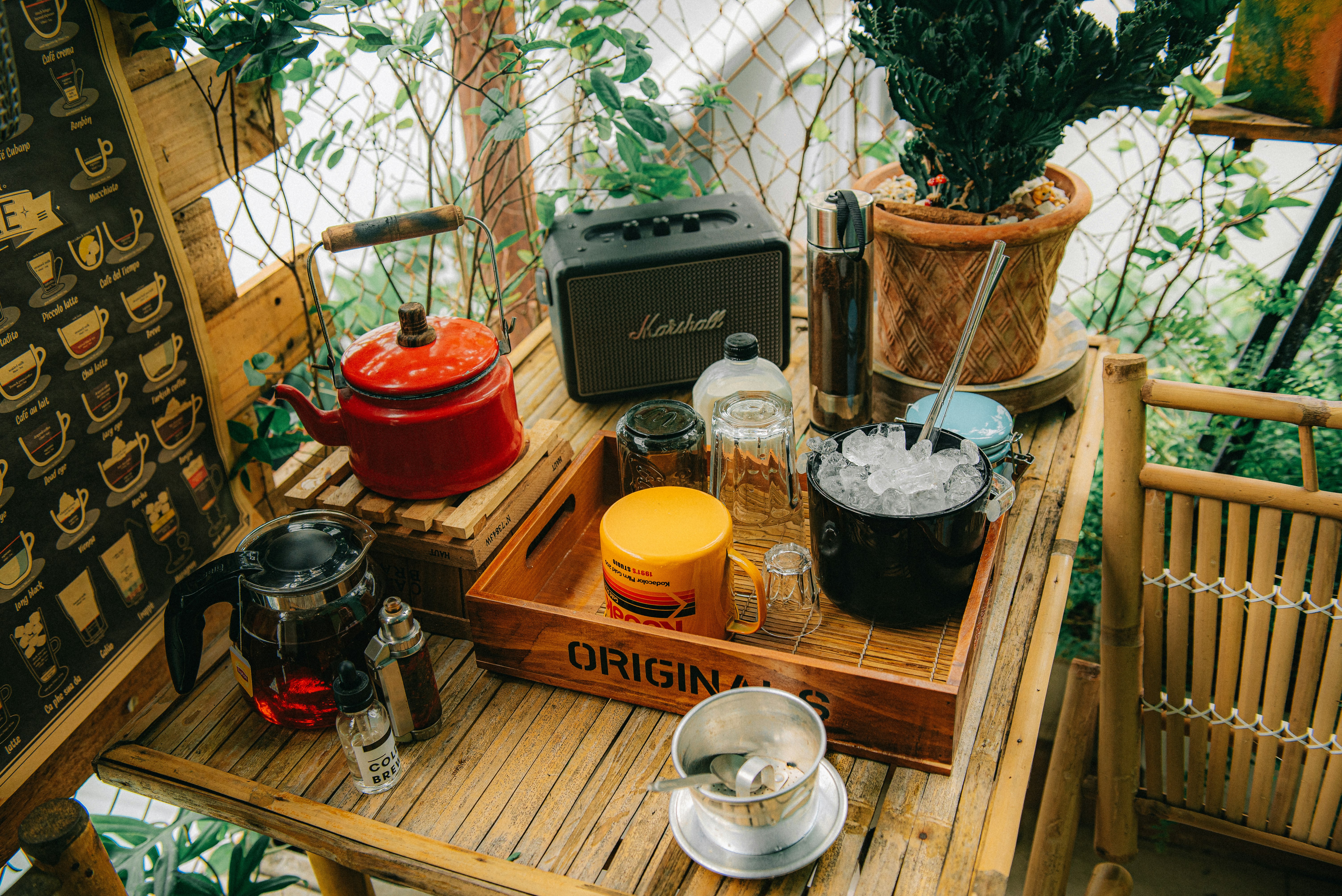 black and red cooking pots on brown wooden table